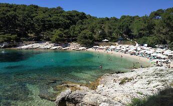 People swimming in a bay, Lošinj, Croatia. Unsplash:Alexandre Ours