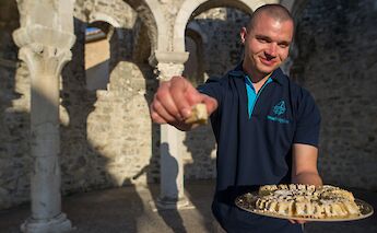 Tour guide with cake, Croatia. CC:Island Hopping