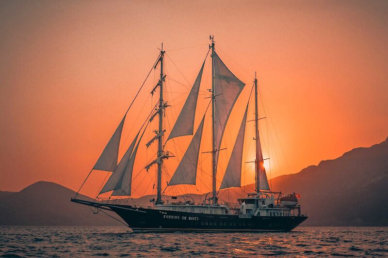 A beautiful sunset, Running on Waves, Bike and boat tour