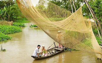 On a boat under fishing nets, Vietnam. Unsplash:Getty Images
