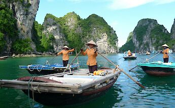 Traditional boats in Ha Long Bay, Vietnam. Unsplash:Gary Cacciatore