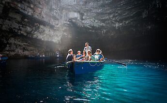 Boat tour of a cave. CC:Tobias Wenkemann