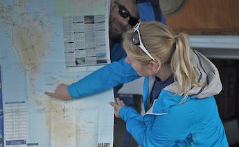 Looking at the map. CC:Island Hopping