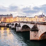 Lights along a bridge over the river Seine, Paris, France. Anthony Delanoix@Unsplash