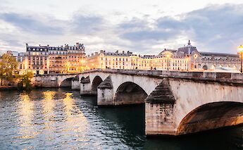 Lights along a bridge over the river Seine, Paris, France. Anthony Delanoix@Unsplash