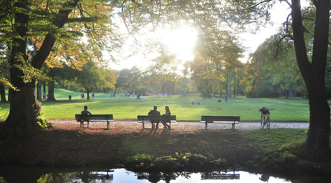 People sitting in the English garden, Munich, Germany. I do nothing but love@Unsplash
