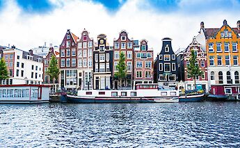 Barges on the canal in Amsterdam, Holland. Unsplash:Tobias Kordt