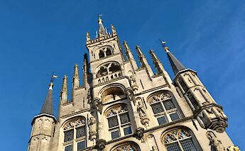 Blue skies above St. John's Church, Gouda, Holland. Unsplash:Dimitri Witte