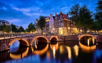 Illuminated bridge, Amsterdam, Holland. Unsplash:Getty Images