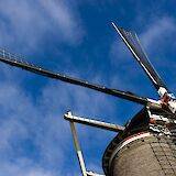 Looking up at a windmill, Gouda, Holland. Unsplash:Yvonne Einerhand