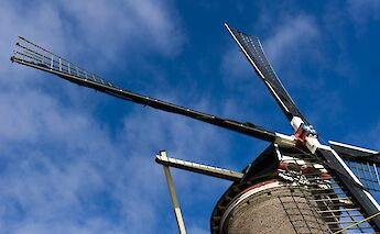Looking up at a windmill, Gouda, Holland. Unsplash:Yvonne Einerhand