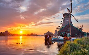 Zaanse Schans sunset, Holland. Unsplash:Getty Images