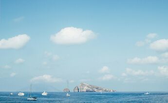 Boats near Panarea, Italy. Unsplash:Giuseppe Murabito