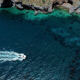 Speedboat near Lipani, Italy. Unsplash:Reegan Fraser