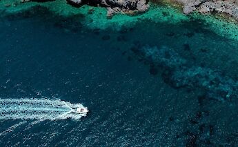 Speedboat near Lipani, Italy. Unsplash:Reegan Fraser