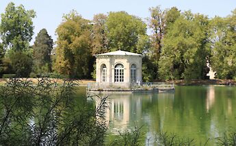 Building by a lake, Palace of Fontainebleau, France. Unsplash:Isaac Arnault
