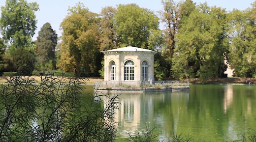 Building by a lake, Palace of Fontainebleau, France. Unsplash:Isaac Arnault
