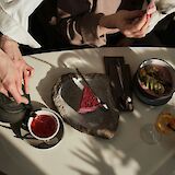 Enjoying tea and dessert. Andrej Lisakov@unsplash
