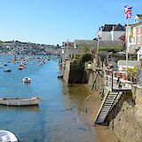 Low tide in classic Cornish harbor town. To-Cco