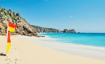 The turquoise waters of Porthcurno Beach, Cornwall.  Benjamin Elliott@unsplash
