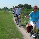 Canal side cycling in the Dutch countryside. to-BBT