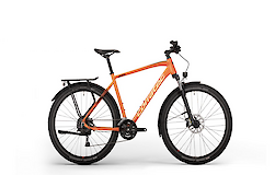 An orange trekking bike with fenders and a rear rack, designed for versatile riding.