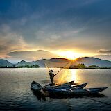 Fishing boats at sunrise. quang nguyen vinh@pexels