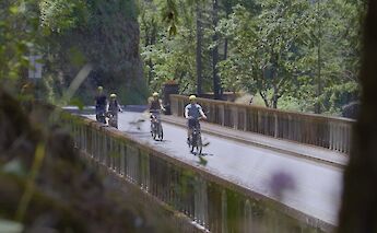 Biking on a bridge, Multnomah Falls, Oregon, USA. CC:Ebike Multnomah Falls