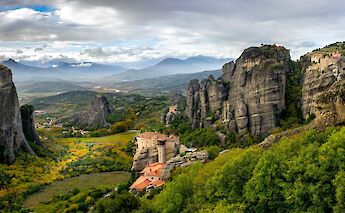 The monasteries of Meteora rise above the Thessalian Plain. Unsplash@YaronTal