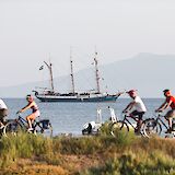 E-bike riders on a coastal route. c-toIH