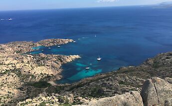 Elba’s rugged coastline and turquoise waters. c-toIH