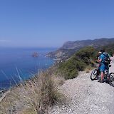 Cyclist overlooking the sea. c-toIH