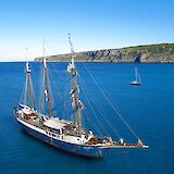 The tall ship, Atlantis, anchored along the Tuscan coast. c-toIH
