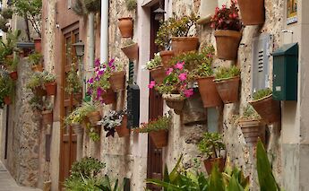Flower-filled balconies in a Tuscan village. c-toIH