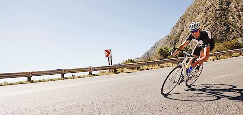 Riding down a mountain road on a road bike. Getty Images@Unsplash