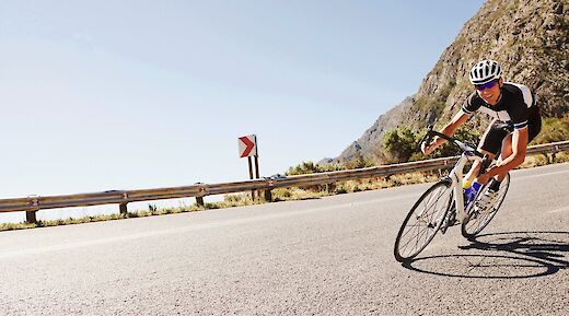 Riding down a mountain road on a road bike. Getty Images@Unsplash