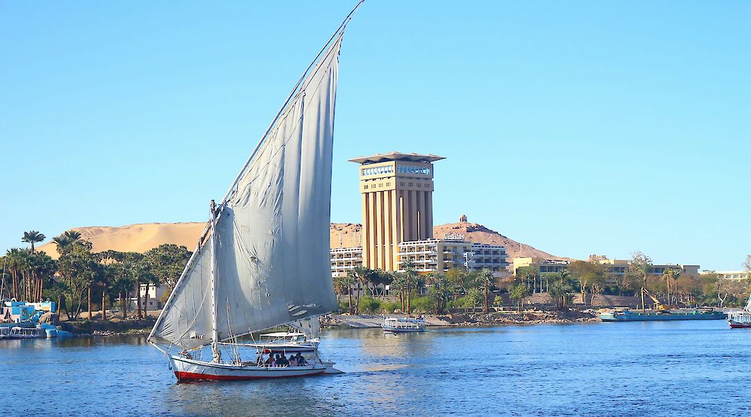 A traditional felucca sailing on the Nile in Aswan. AbdullahHelwa@unsplash