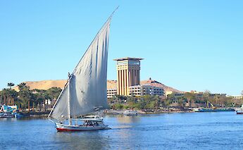 A traditional felucca sailing on the Nile in Aswan. AbdullahHelwa@unsplash