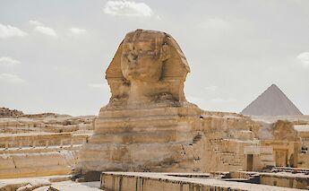 The Sphinx with the Great Pyramid in the background. HossamMOmar@unsplash