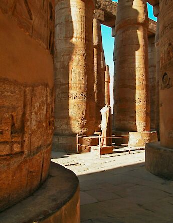 Inside the Karnak Temple with towering sandstone columns. GettyImages@unsplash