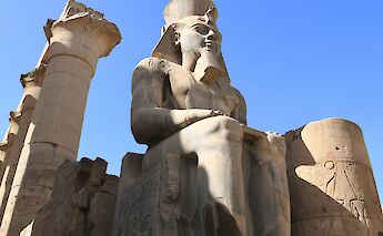 Colossal statue at Luxor’s Temple Complex. Hongbin@unsplash