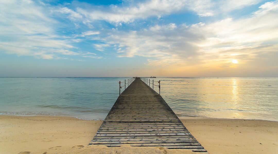 A pier stretching into the calm Red Sea. SandroGautier@unsplash