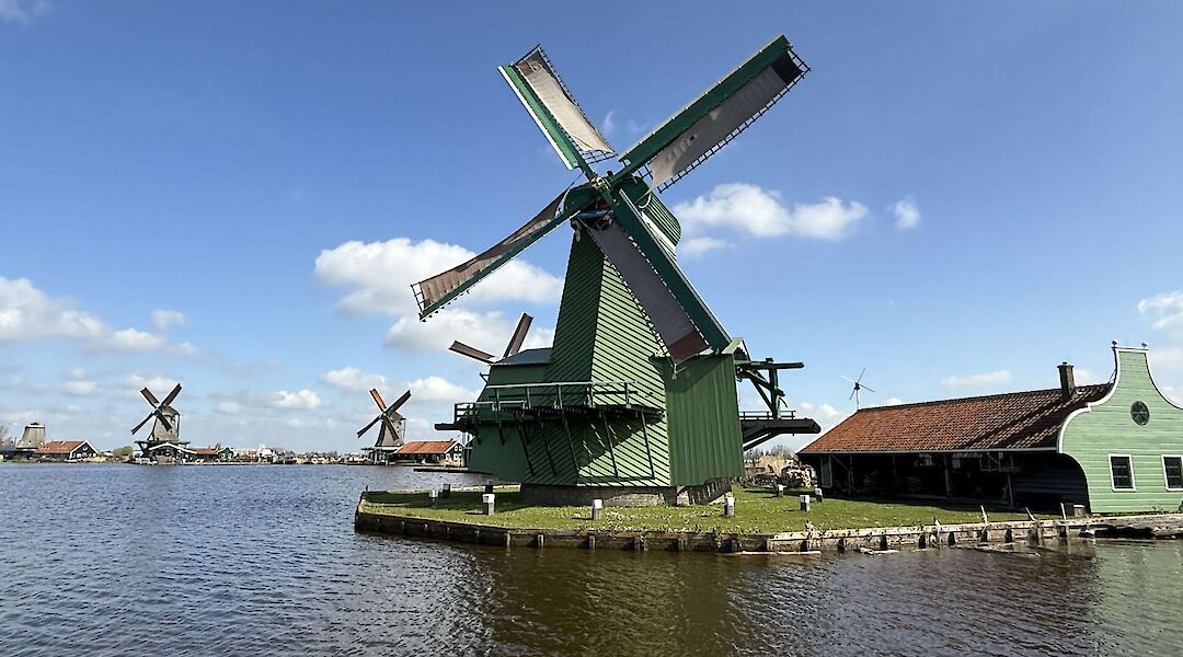 Green windmills of Zaanse Schans, Amsterdam e-bike tour. CC:TO