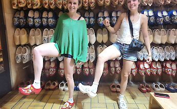 Trying on clogs at the clog-making farm, Amsterdam e-bike tour. CC:TO