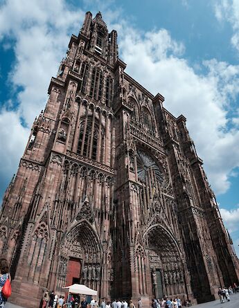 Blue sky and clouds above Strasbourg Cathedral, Strasbourg bike tour, France. Patrick Robert Doyle@Unsplash