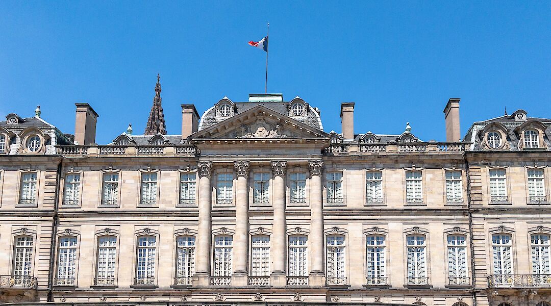 French flag above the Palais Rohan, Strasbourg bike tour, France. Kent Wang@Flickr