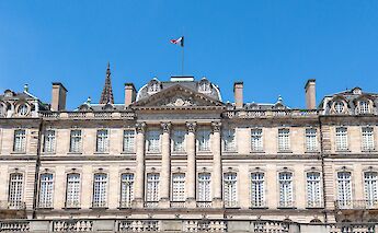 French flag above the Palais Rohan, Strasbourg bike tour, France. Kent Wang@Flickr