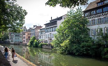 Strolling along the canal, Strasbourg bike tour, France. Kamilla Isalieva@Unsplash