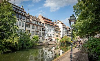 Houses along the canal, Strasbourg bike tour, France. Kamilla Isalieva@Unsplash