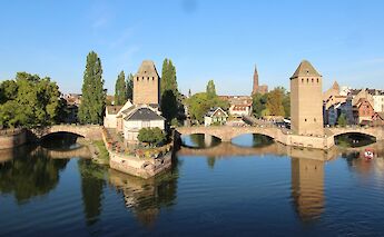 Reflections from the Covered Bridges, Strasbourg bike tour, France. Arvid Hoidahl@Unsplash